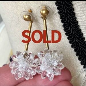Dangling pierced clear snowflake earring